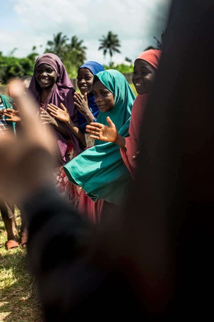 a group of women standing next to each other